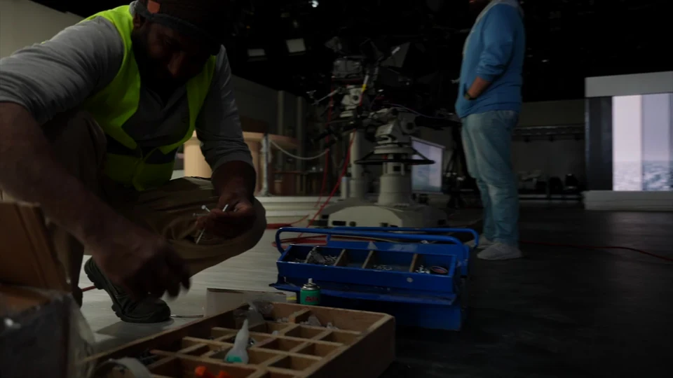 Film still at 26.08s. TWI — Building the Television Kitchen.