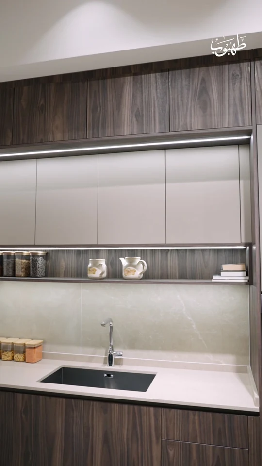 Tahboub Home — Dark Wood, Light Cabinetry. Film still at 14.64s.